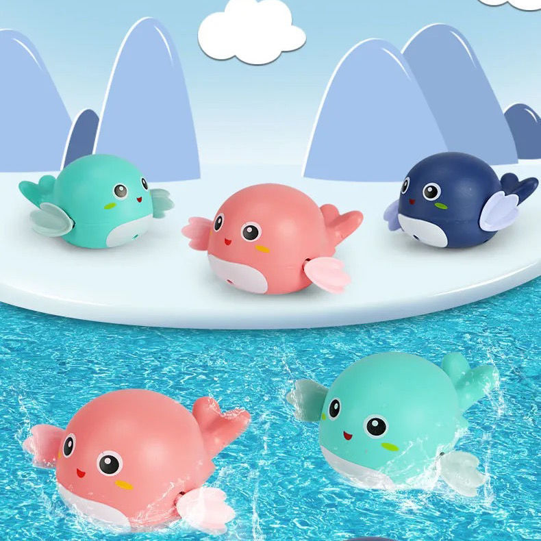 Baleines nageuses turquoise, rose et bleu nuit dans un décor de montagnes et d'eau