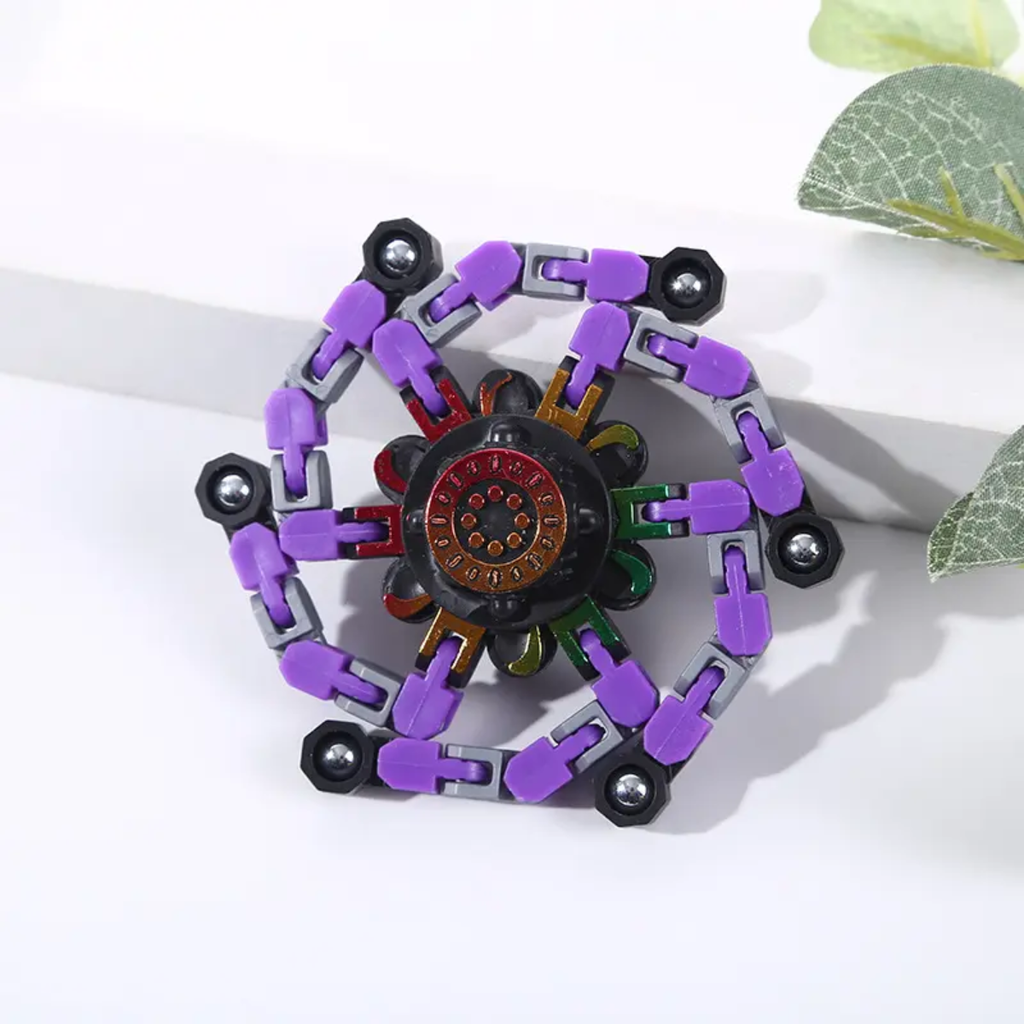 Quatre fidget spinners transformables en araignée, coloris rouge, bleu, jaune et violet